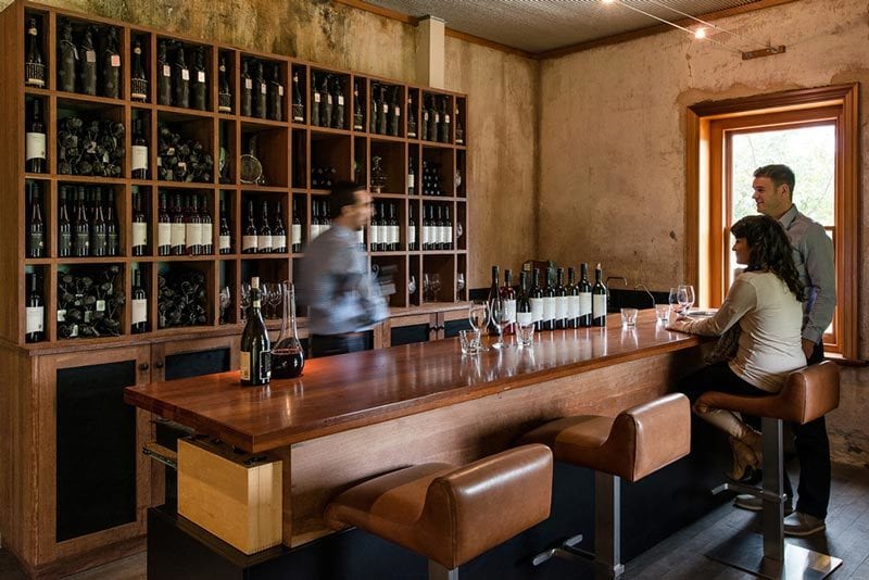 Drinking establishment, Interior design, Furniture, Table, Bottle, Barware, Building, Wood, Shelf, Window